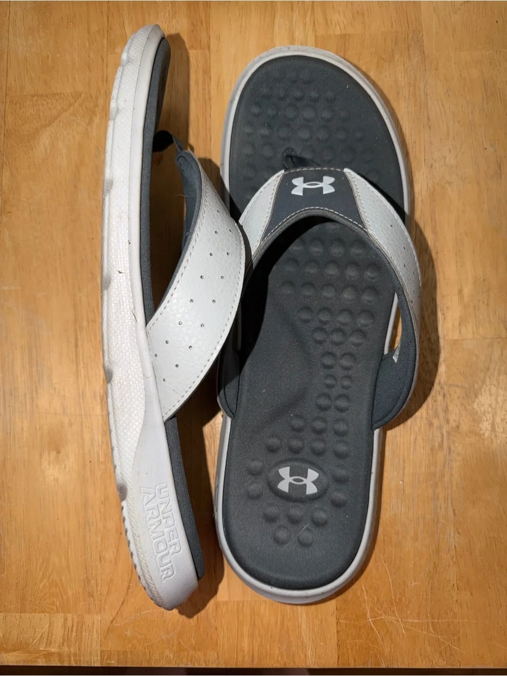 Under Armour men’s flip flops. Size 12. Worn once.